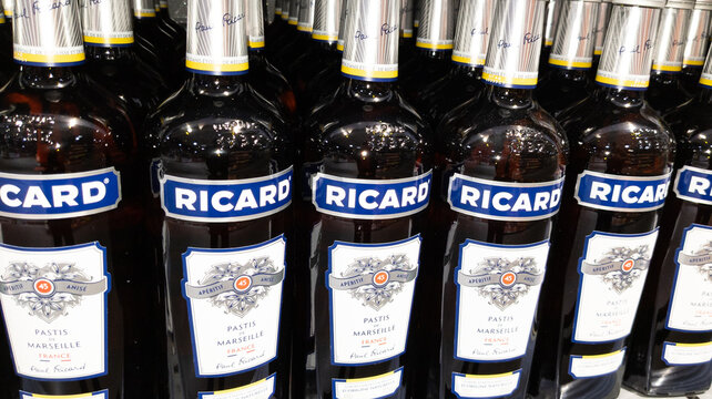 A bottle of Ricard 45 pastis and a glass and a carafe of water on