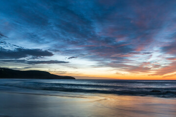 Sunrise at the beach with high cloud