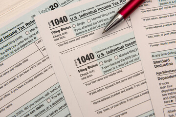 close up of empty us tax form 1040 and ballpoint pen