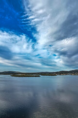 Late afternoon flight over the bay with cloud cover