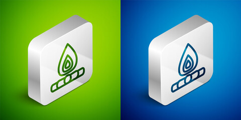 Isometric line Campfire icon isolated on green and blue background. Burning bonfire with wood. Silver square button. Vector