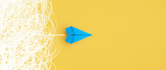 Business for solution concept. blue paper plane on yellow background