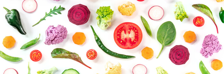 Healthy vegan food panoramic banner. Fresh vegetables and other salad ingredients, top shot on a white background