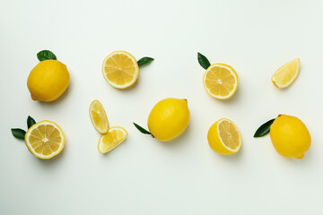 Ripe lemons on white background, top view