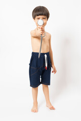 Asian boy plays stethoscope on white background. Healthcare for Baby and skills develop concept.