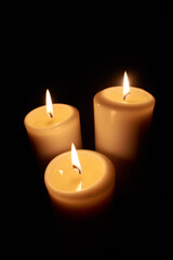 Obraz na płótnie Canvas three burning candles