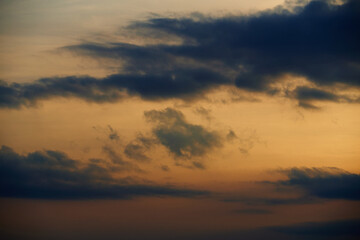 Fototapeta na wymiar beautiful sunset sky, dark silhouette of clouds as a background