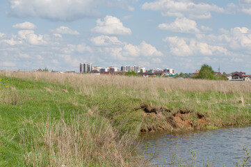 Fototapeta na wymiar landscape with city houses in the field