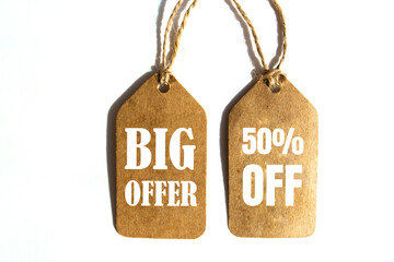 Big Offer 50% off price tag with brown string on white background