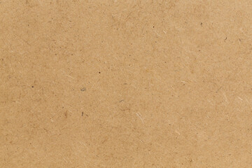 Pressed beige chipboard texture.