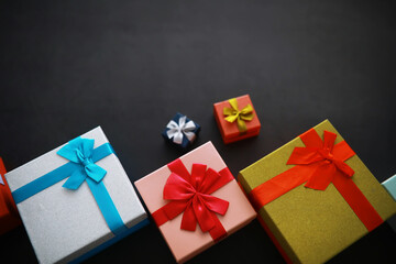 Christmas decoration. Gift boxes on black stone  background. Christmas greeting card concept.