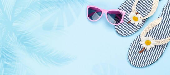 Beach flip flops with flowers and sunglasses