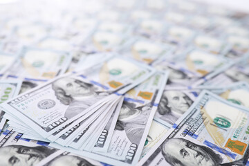 Group of money stack of 100 US dollars banknotes a lot of the background texture. Cash money in a large pile as a finance background.