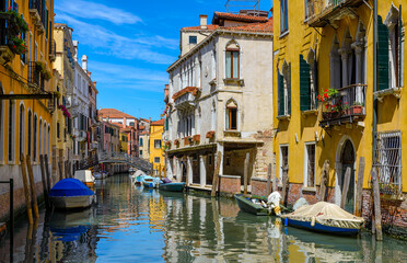 Narrow canal with bridge in Venice, Italy. Architecture and landmark of Venice. Cozy cityscape of Venice.