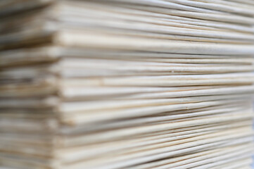 Close up corner of old newspapers folded stacked