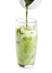Pouring green matcha into glass with milk and ice isolated on white background.