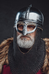 Headshot of medieval elder knight wearing helmet