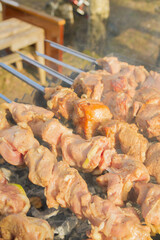 Shish Kebab made from pieces of pork is cooked on skewers on the grill