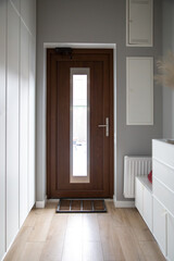 Corridor interior with an entrance door in a private house.