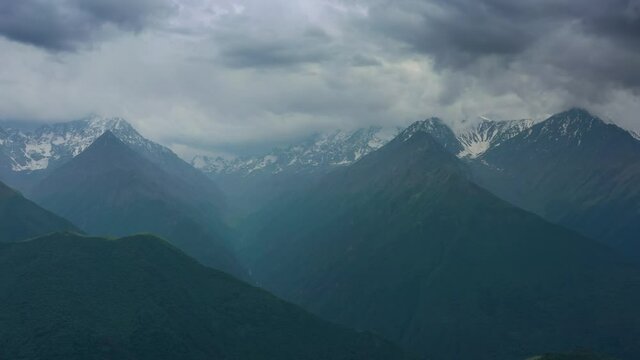 Aerial panorama of high Caucasus Mountains in dusk, Republic of Ingushetia, Russia, 4k
