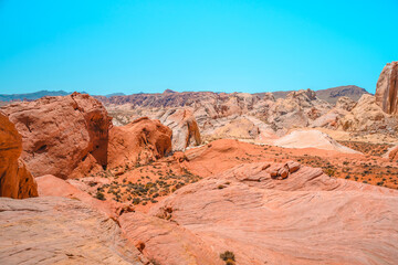 Valley of Fire National Park in Nevada. Orange amazing landscape, stones of different shapes and a fire wave