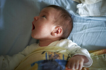 Playful baby searching her surroundings