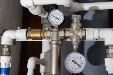 Water supply pipes with pressure gauges, valves and check valve