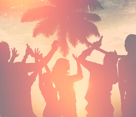 A group of diverse people dancing at the beach