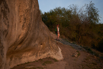 Naklejka premium Young woman walk and looking at the landscape and enjoying the view and fresh air.