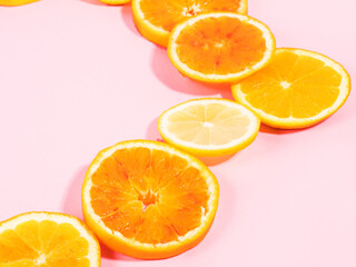 Colorful orange citrus slice fruit texture background on pastel pink