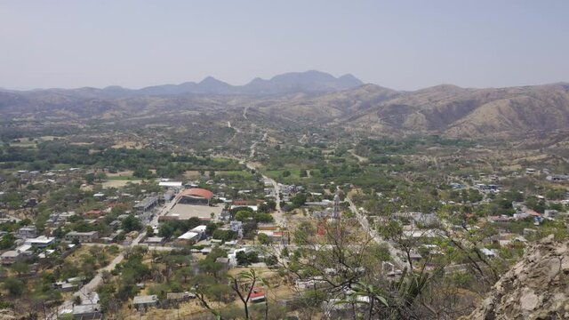 High angle shot of plants and hills on a sunny day in Mixteca Poblana, Puebla, Mexico