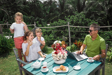 Family eating fresh breakfast outdoors