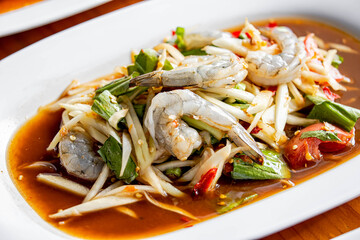 Tum Khung kod.Som Tum or Thai shrimps papaya spicy salad.Traditional Thai cuisine
