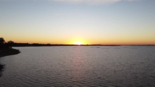 Beautiful Aerial Drone Shot at Sunset Over Chascomus Lagoon, Argentina