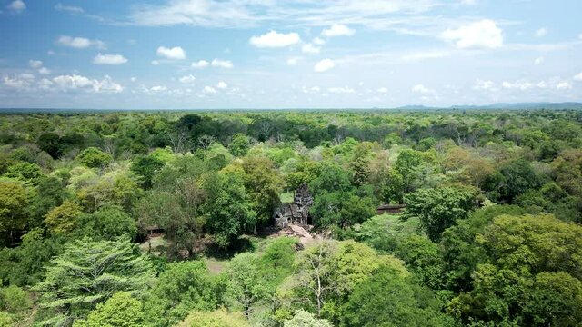 Angkor Temple, Preah Khan Kampong Svay otherwise known as prasat Bakhan. Aerial fly over and reveal in dense rain forest, central Cambodia jungle.