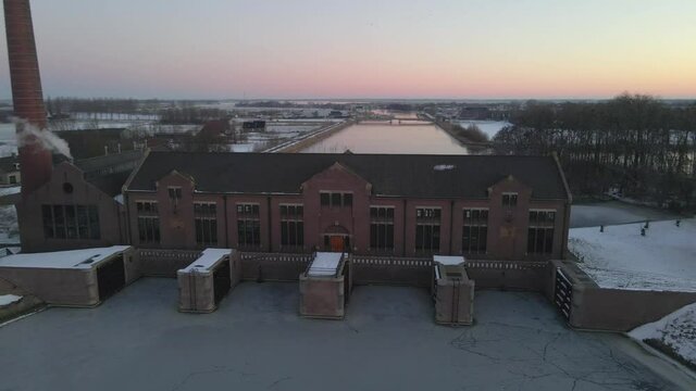 Woudagemaal building at sunrise in winter time Friesland, aerial
