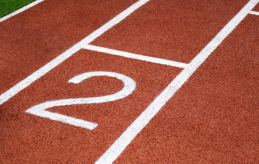 Red running track synthetic rubber surface background.