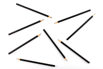 black pencils are chaotic on white background.