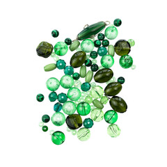 Layout of green beads and marbles isolated on white.