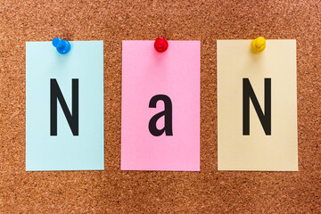 Conceptual 3 letter acronym abbreviation NaN (Not a Number) on multicolored stickers attached to a...