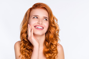 Obraz premium Photo portrait of young model with curly red hair touching face laughing looking blank space curious isolated on white color background