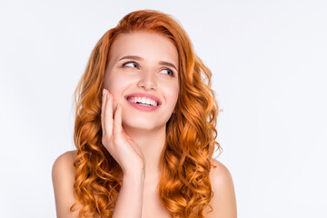Photo portrait of young model with curly red hair touching face laughing looking blank space curious isolated on white color background