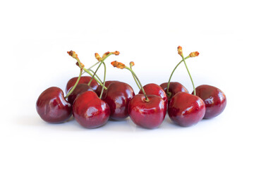 Handful of real cherries on white background