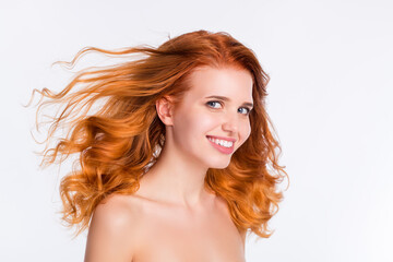 Photo portrait of young woman wavy red hair happy smiling with flying hair naked shoulders isolated...