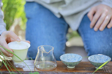 japanese tea ceremony in the spring garden, aroma cherry blossom sakura in asia