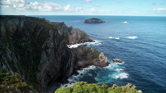 Seascape of Atlantic ocean and Asturias rocky coast at Cape Penas. Sea shore with high cliffs in north Spain.