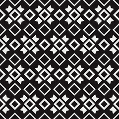 White rhombuses and black background. Vector ornament.