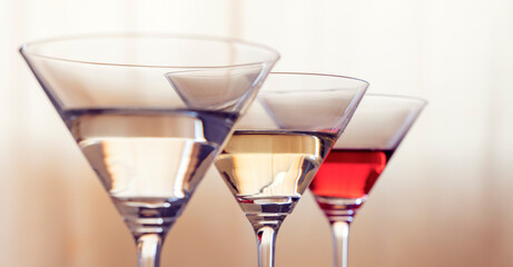 three cocktail glasses with beautiful triangular glasses. close-up. champagne, wine, cocktail. Alcoholic beverages