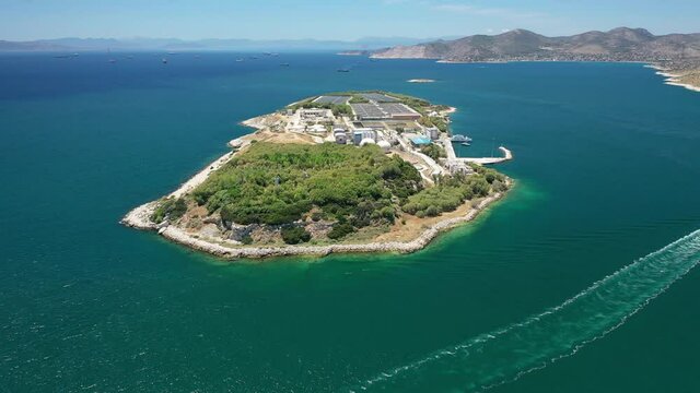 Aerial drone video of latest technology sewage and sludge processing plant in small island of Psitalia or Psyttaleia, Piraeus, Attica, Greece
