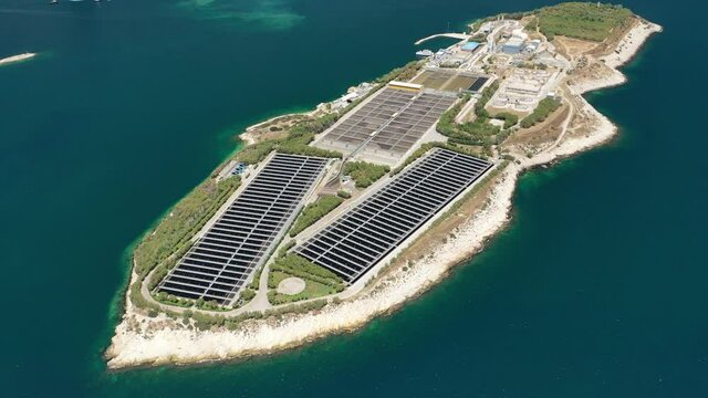 Aerial drone video of latest technology sewage and sludge processing plant in small island of Psitalia or Psyttaleia, Piraeus, Attica, Greece